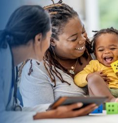 man drawing on dry-erase board