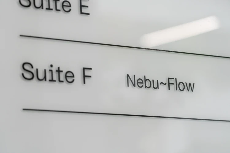 NebuFlow office signage displaying Suite F location