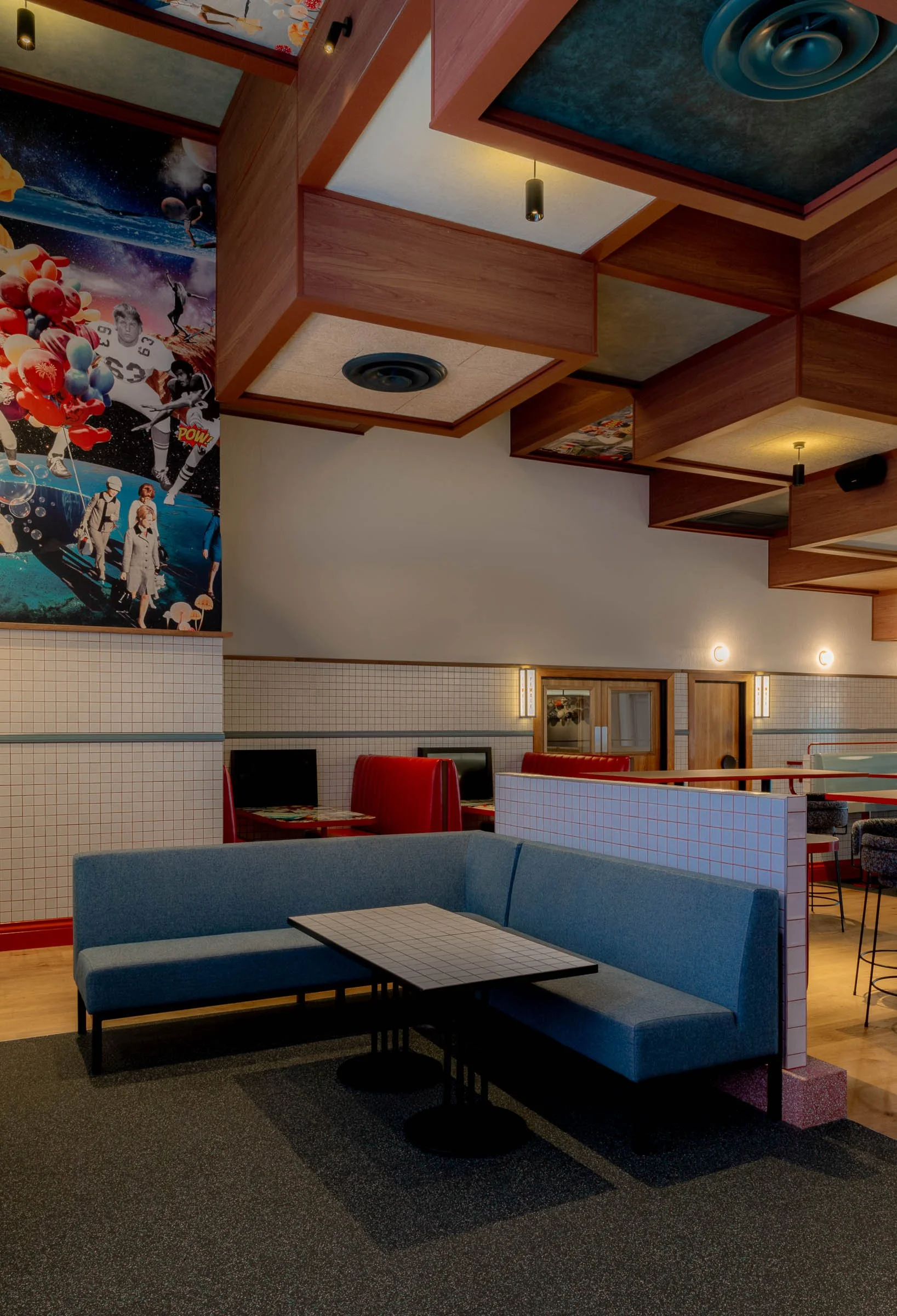 Lounge seating beside collage wall panels