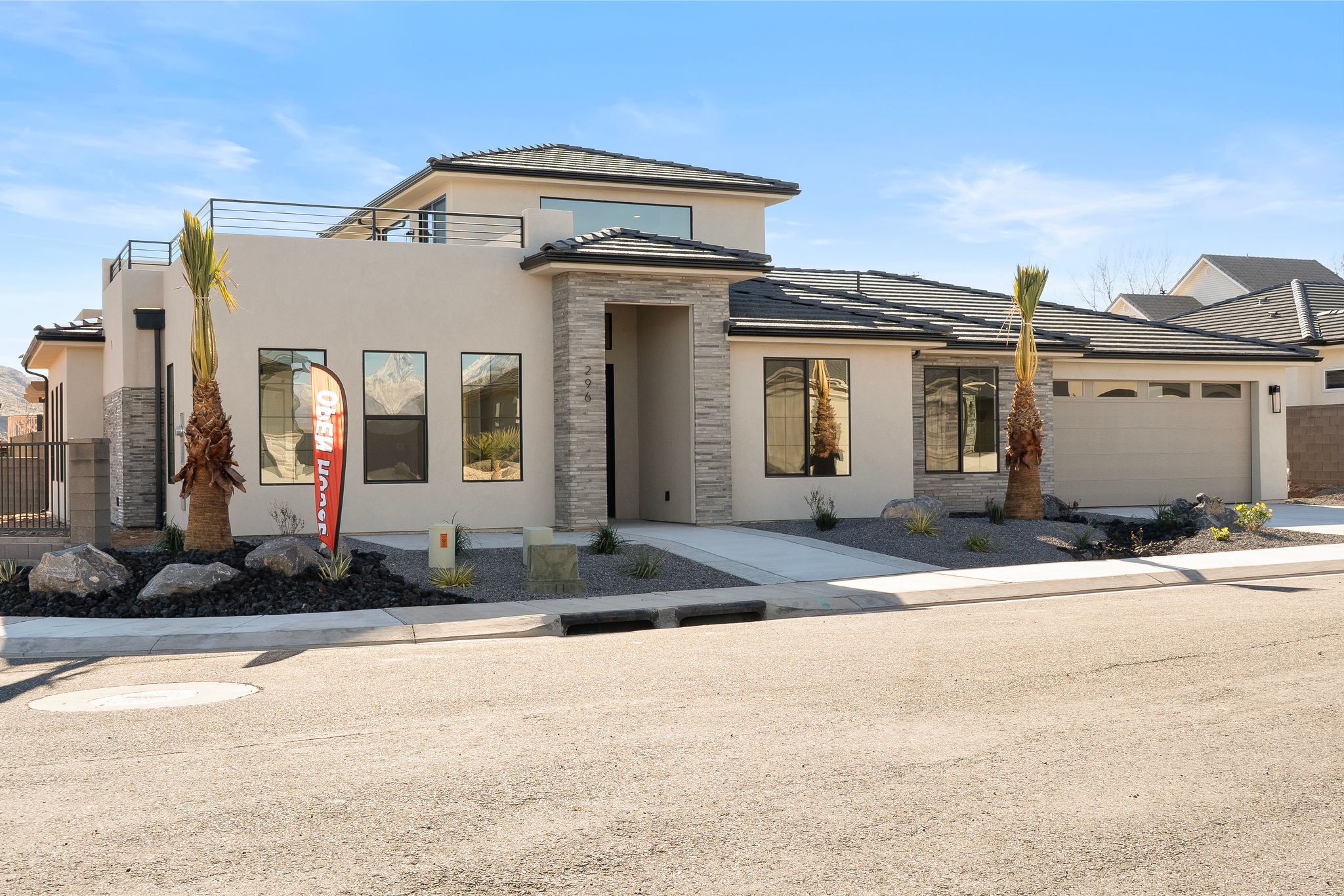 Side exterior of The View at Falcon Ridge in Hurricane, Utah, highlighting architectural details and large windows.