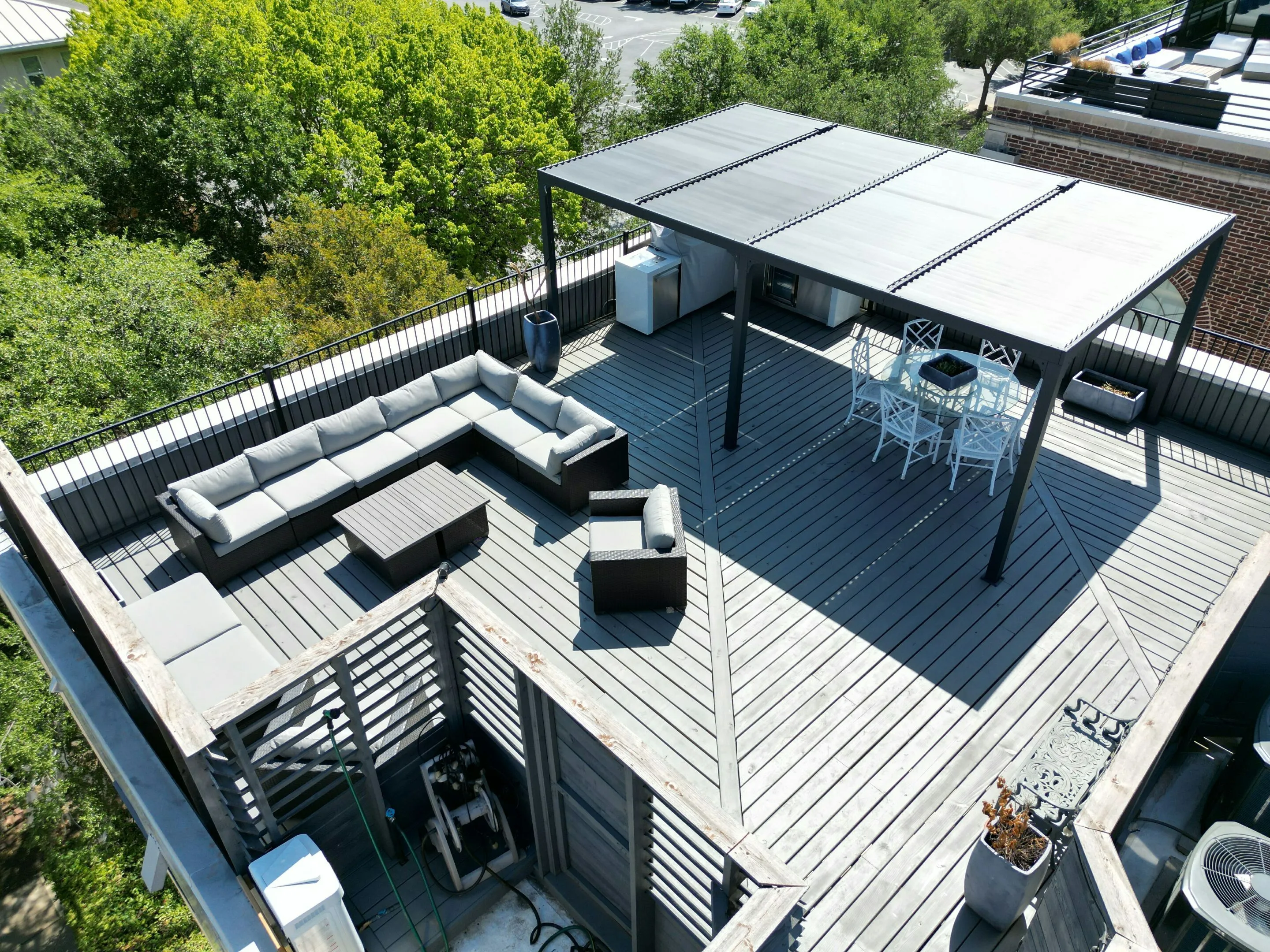 Modern rooftop deck built over flat roofing system in Oak Lawn residential project, Dallas TX
