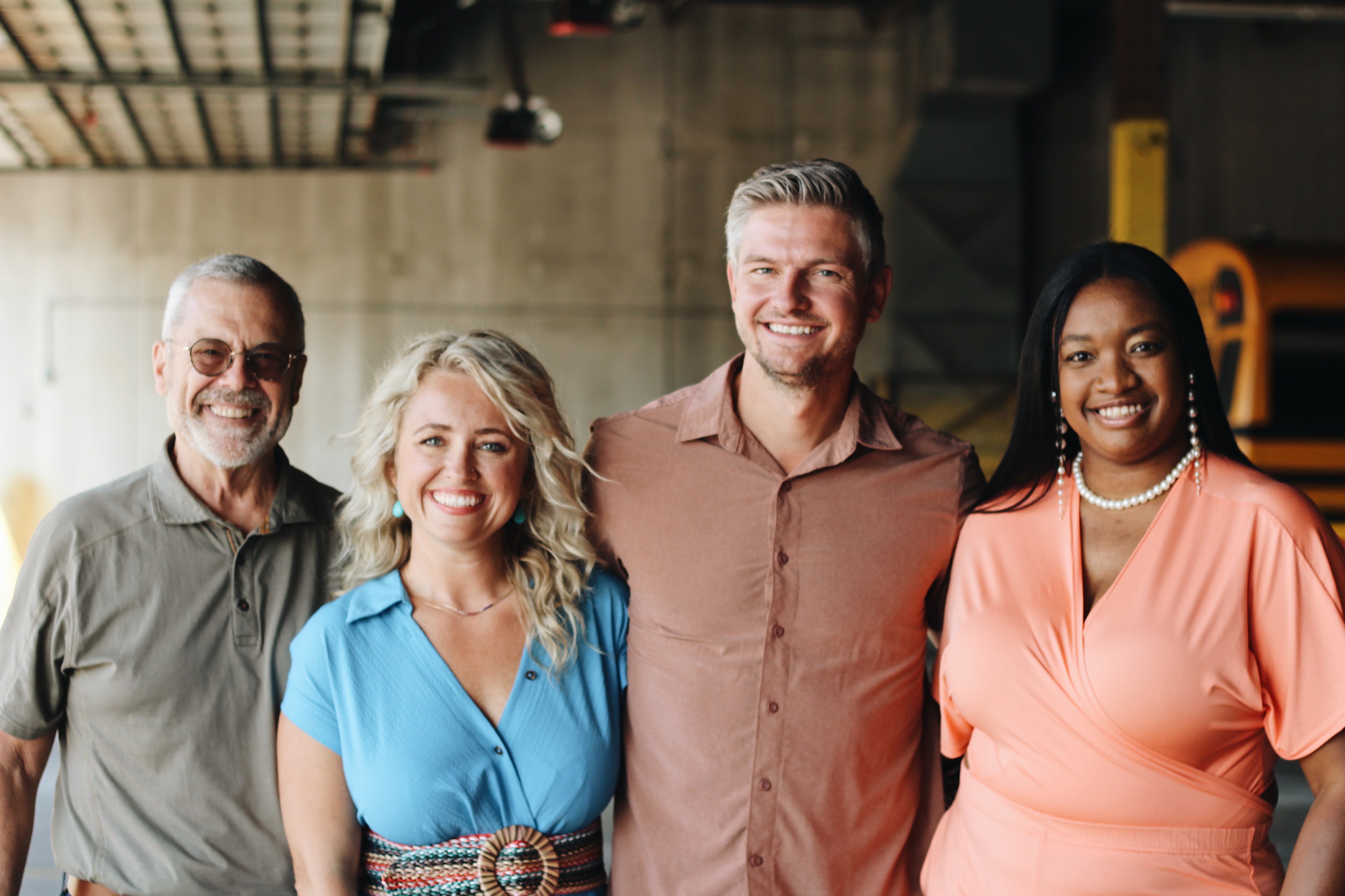 three women sitting beside wooden table