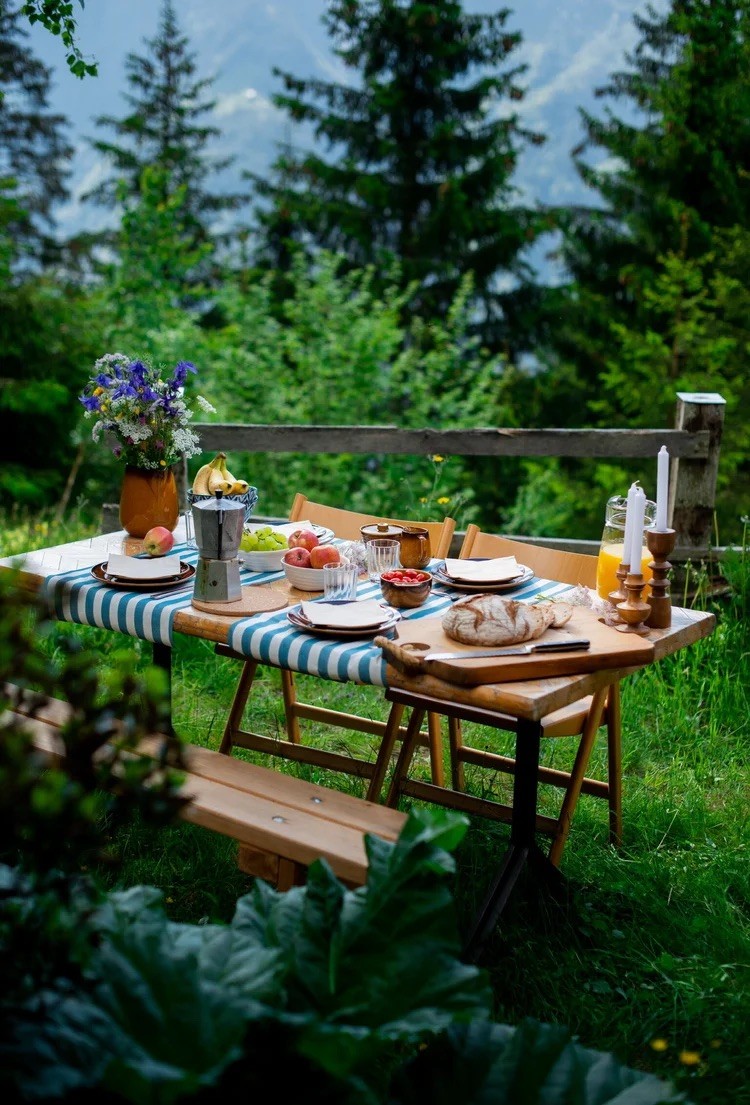 woman in black tank top sitting on brown wooden dock during daytime
