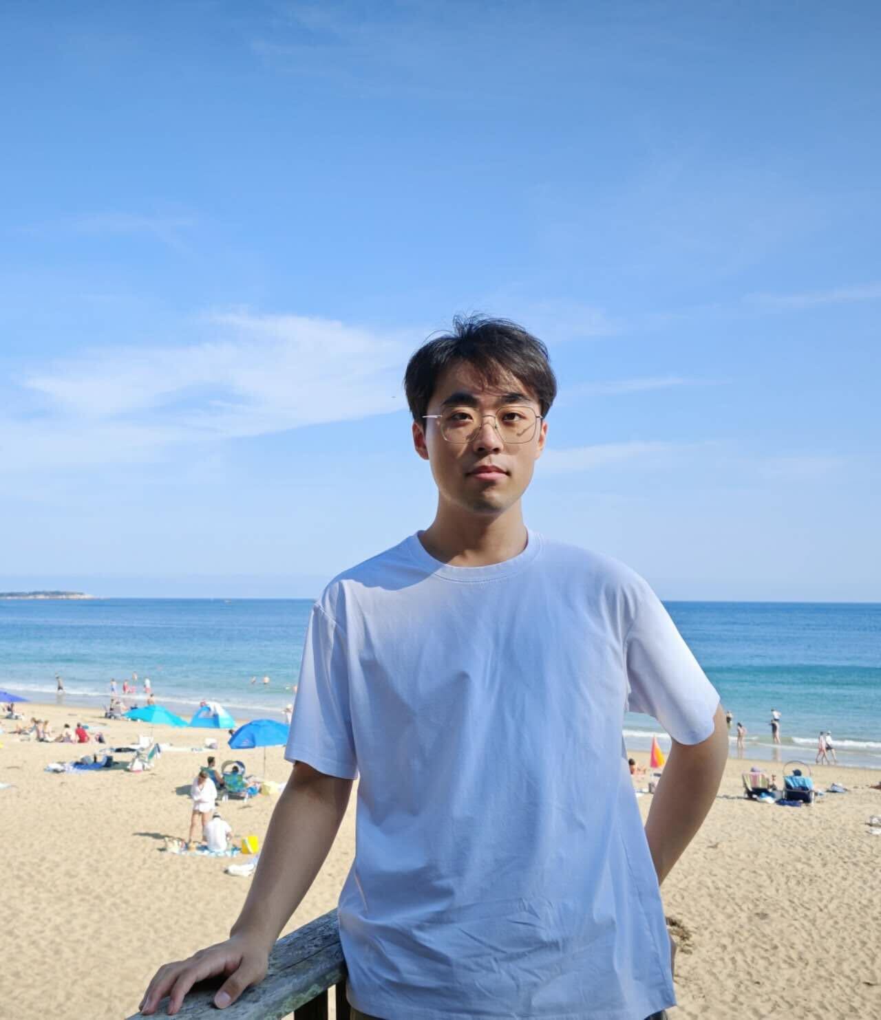 a man wearing glasses and a black shirt