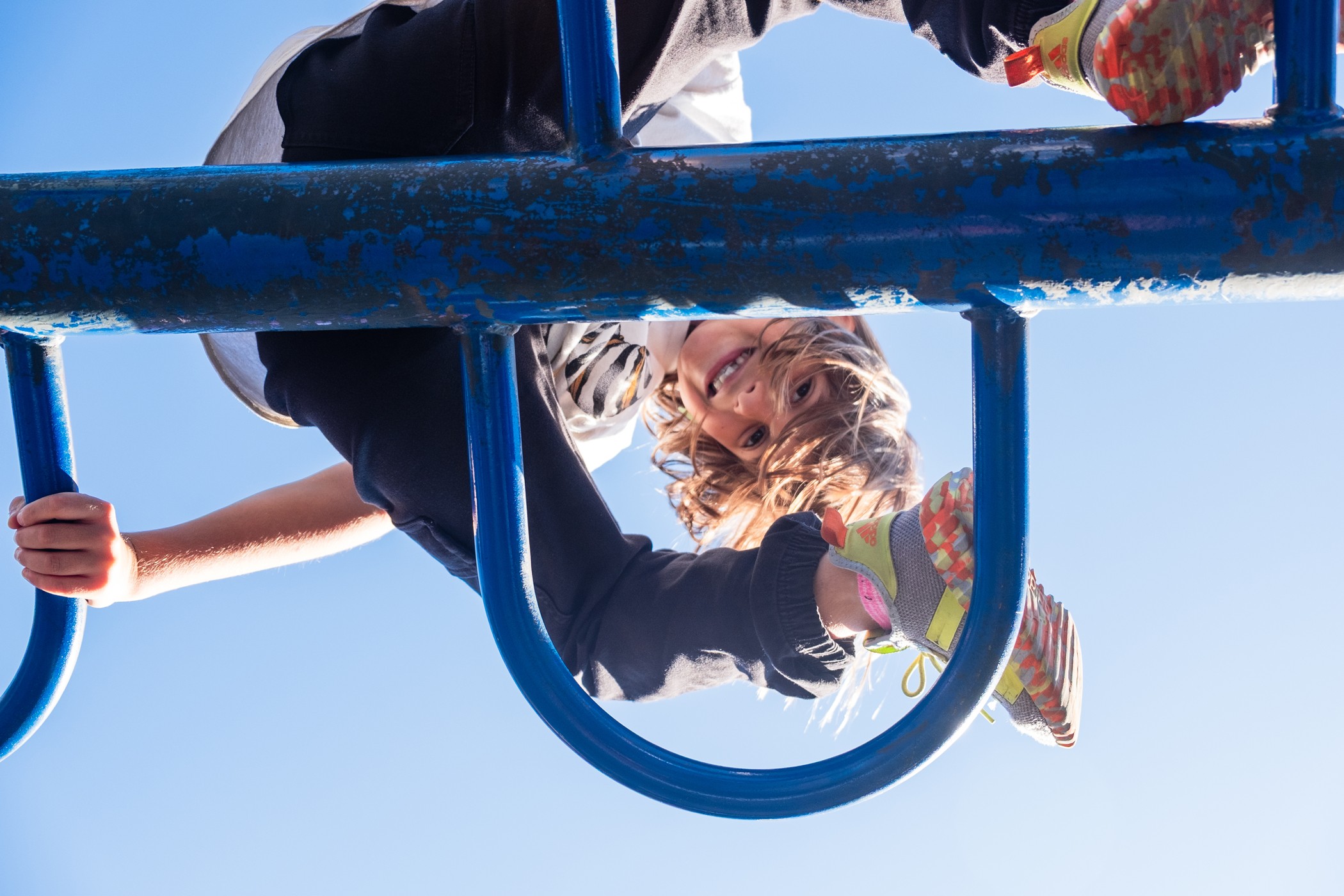 child-climbing-blue-playground-fortgreene-nyc-lifestyle-photography
