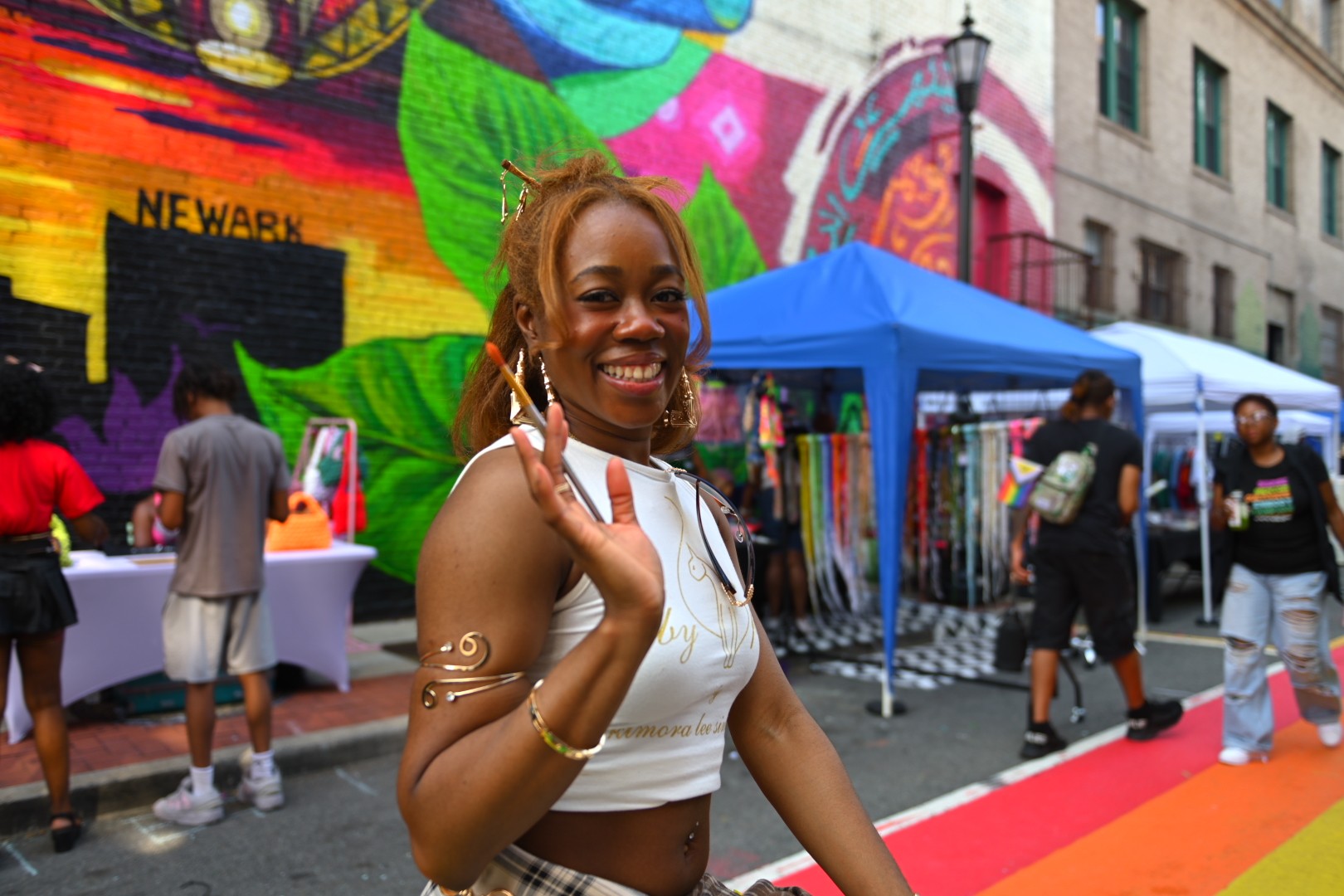 Outdoor Art Block Love experience with Newark mural, painted street, and vendor tents