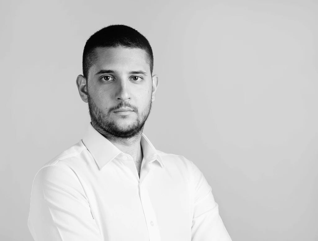 Young businessman with black beard in office