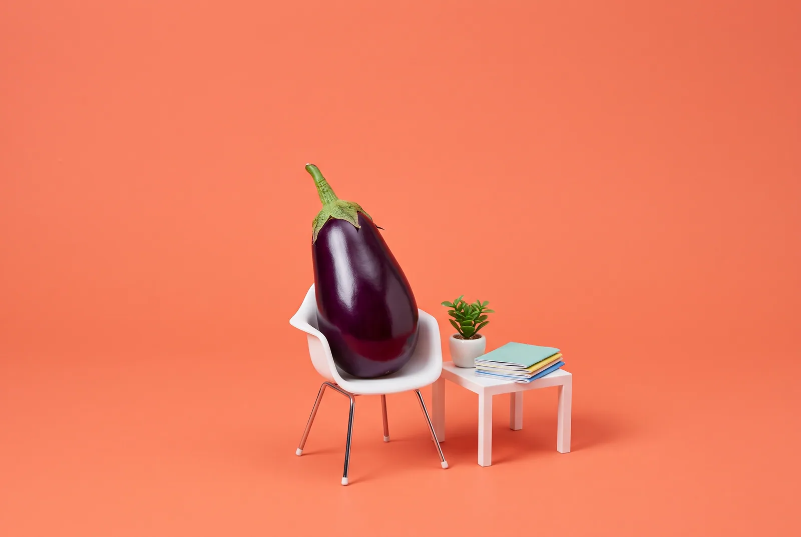 An eggplant waiting in a small waiting-room chair, when to get professional help for gooning addiction