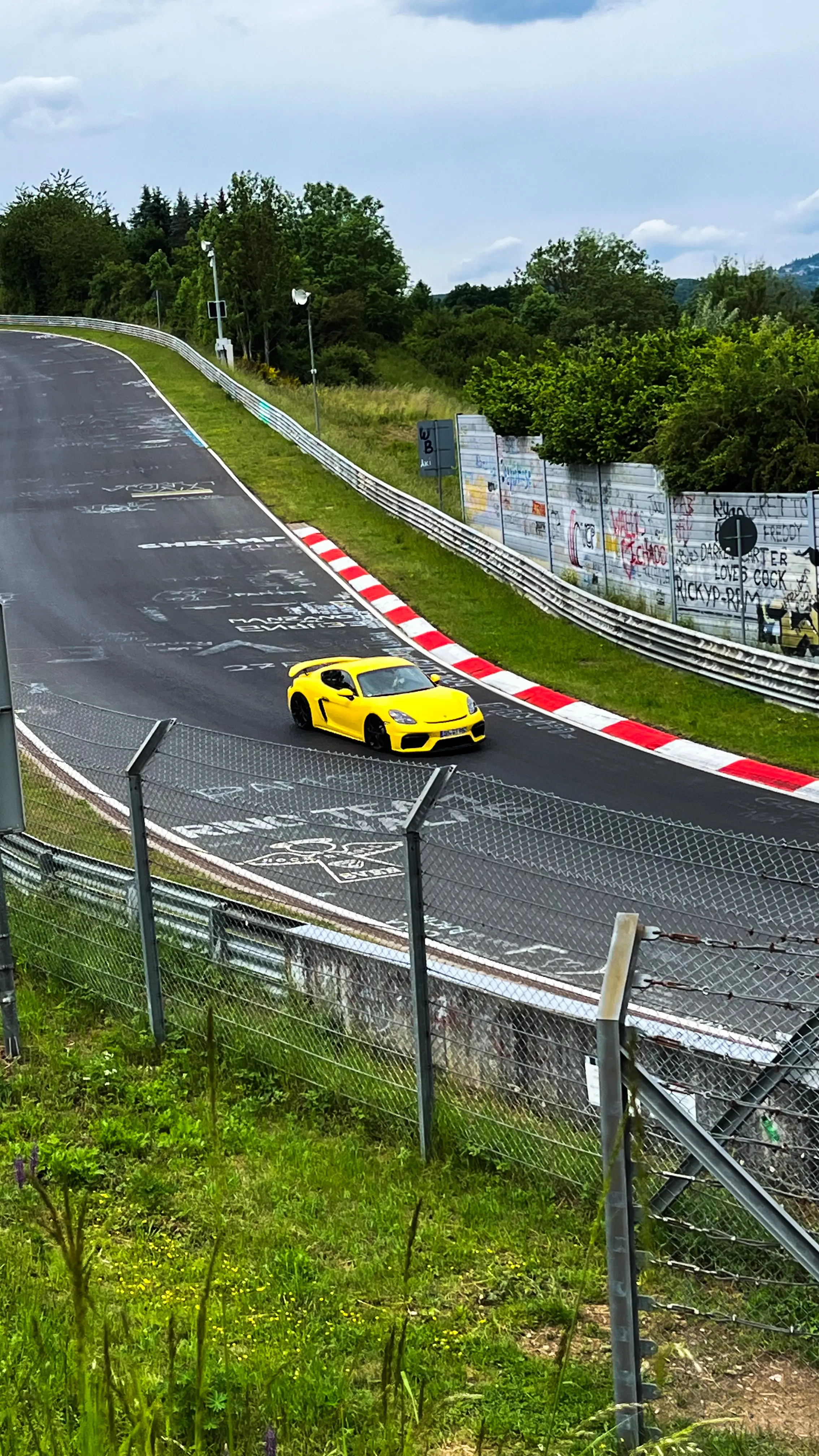 Porsche Cayman in Yellow on The Nurnburgring