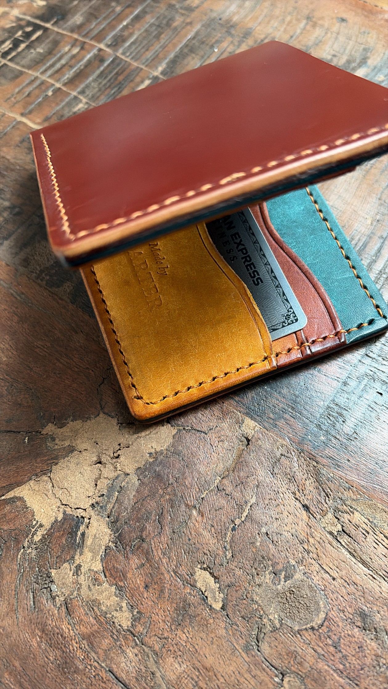 First Light Billfold showing blue, amber and ochre leather
