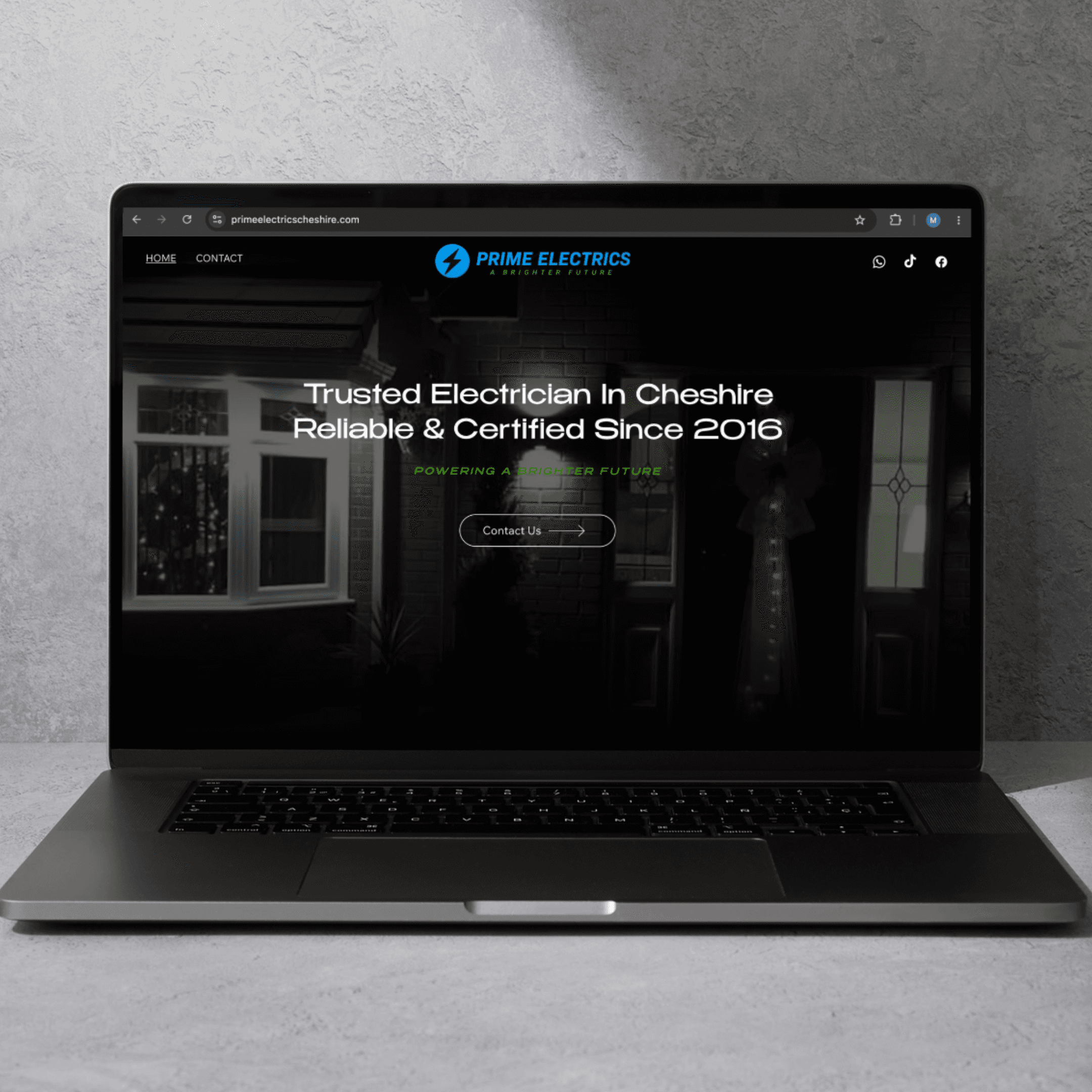 Responsive business website displayed on a laptop and phone