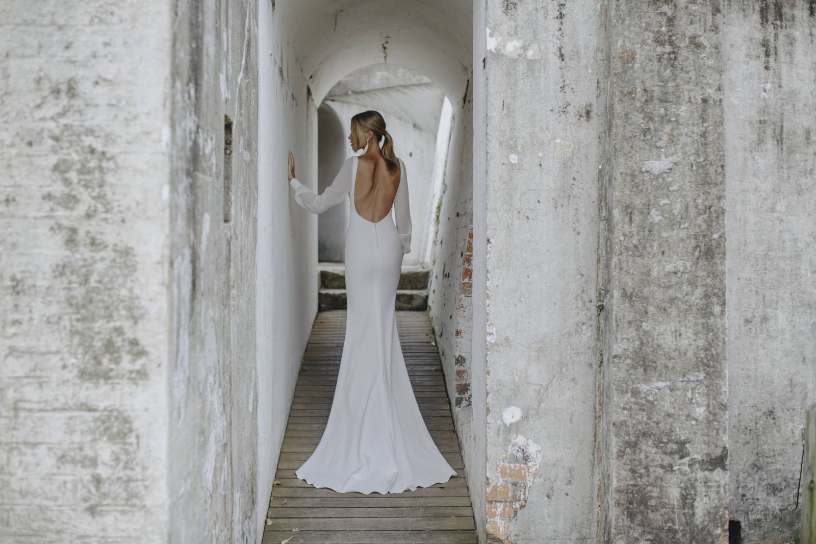 Woman wearing a wedding dress.