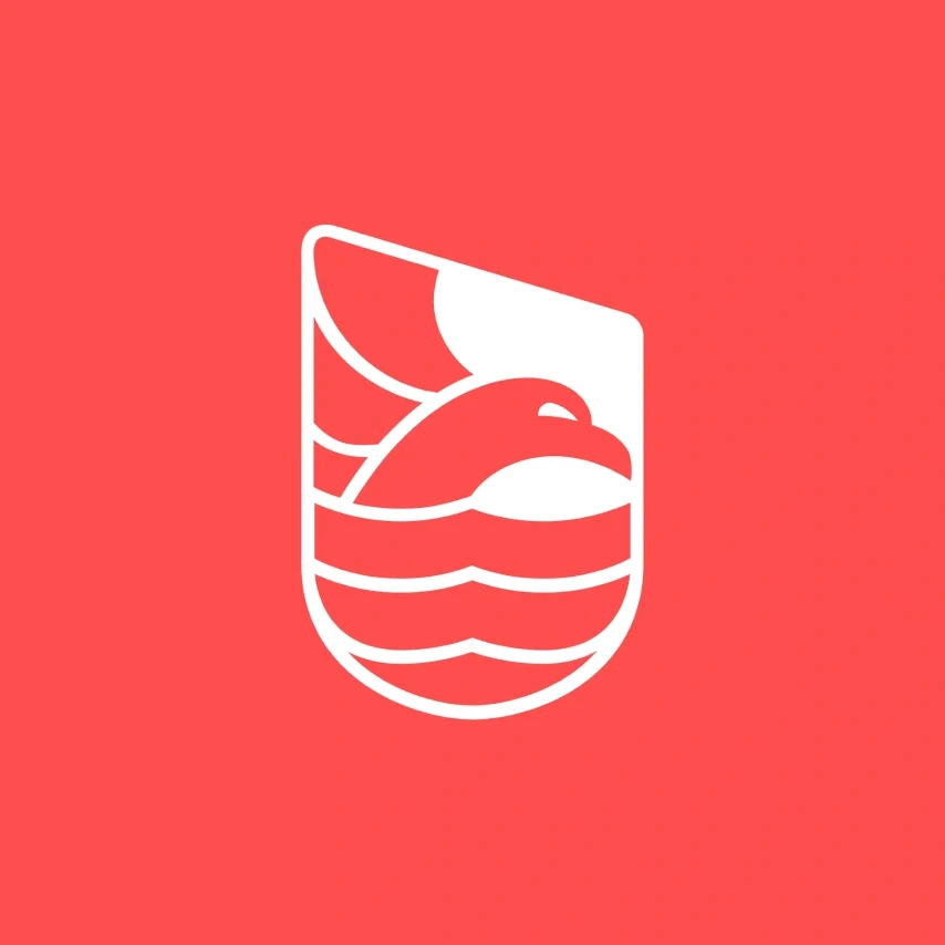 A woman examining a large architectural drawing on a table in a modern studio. Shelves and neatly arranged supplies surround her.