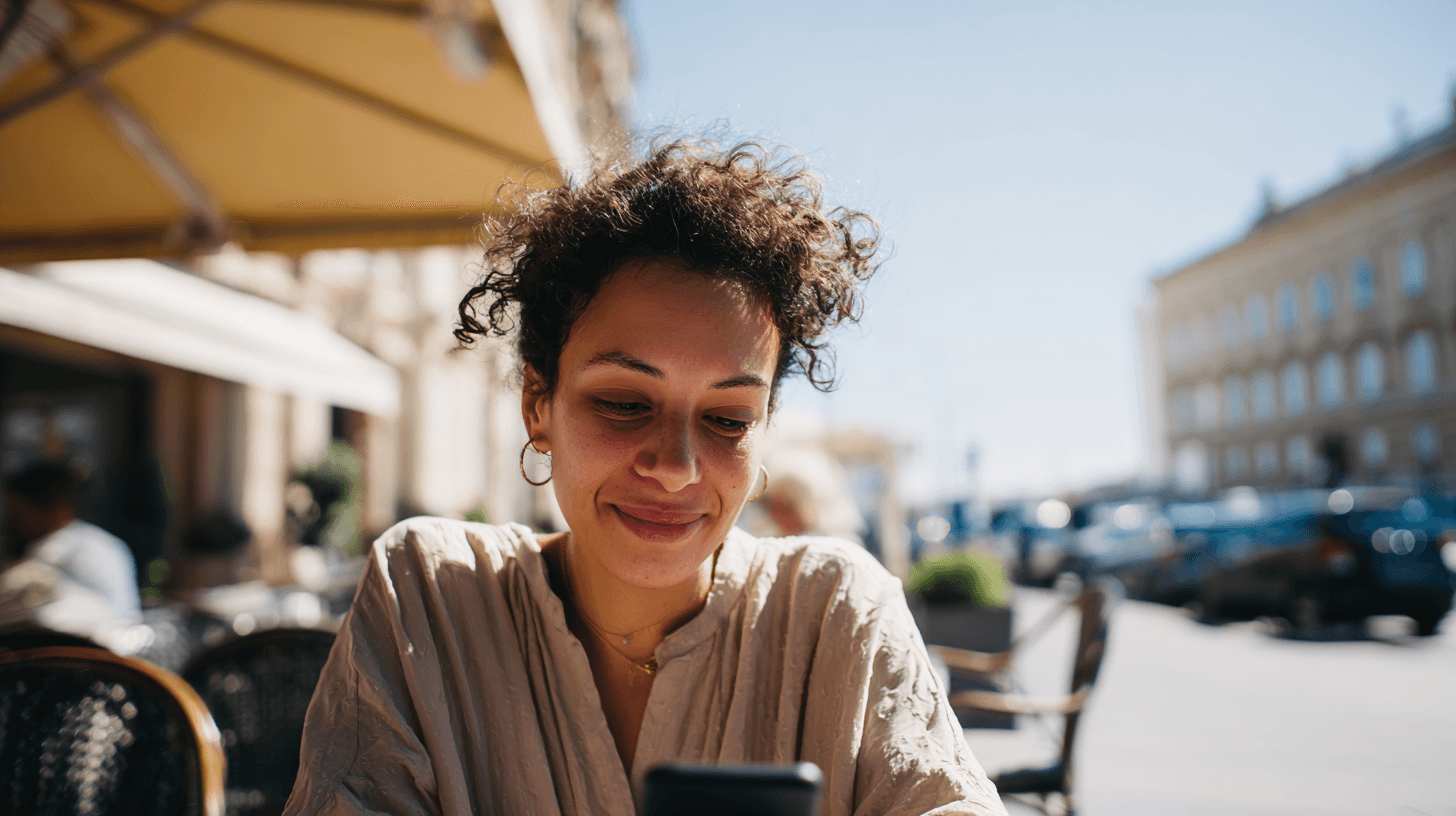 A maroon passport, a credit card, and a document are placed on a dark surface.