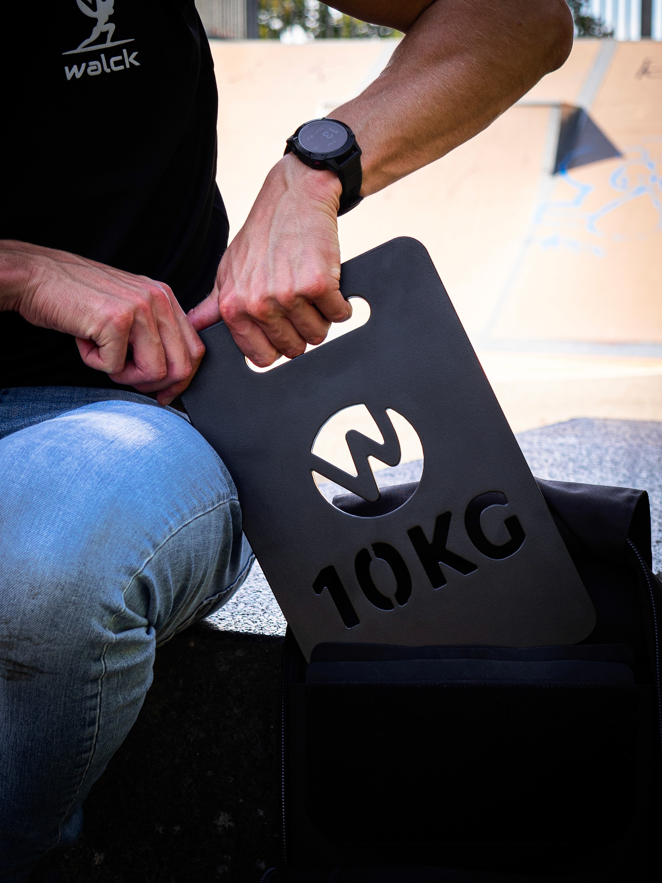 5kg staal gewicht plaat in handen