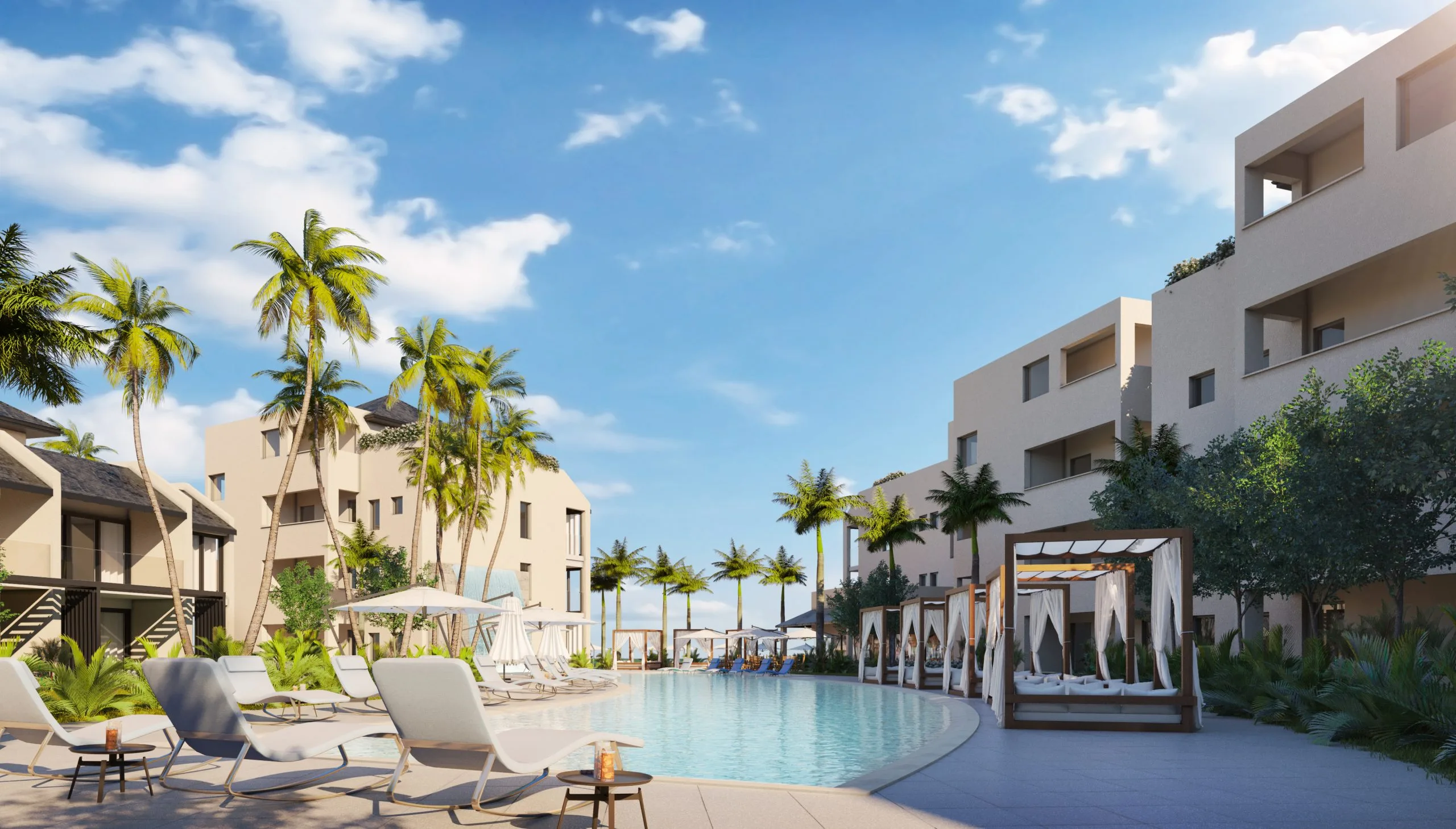 Resort pool with cabanas and beachfront hotel buildings at sunset, St. Lucia
