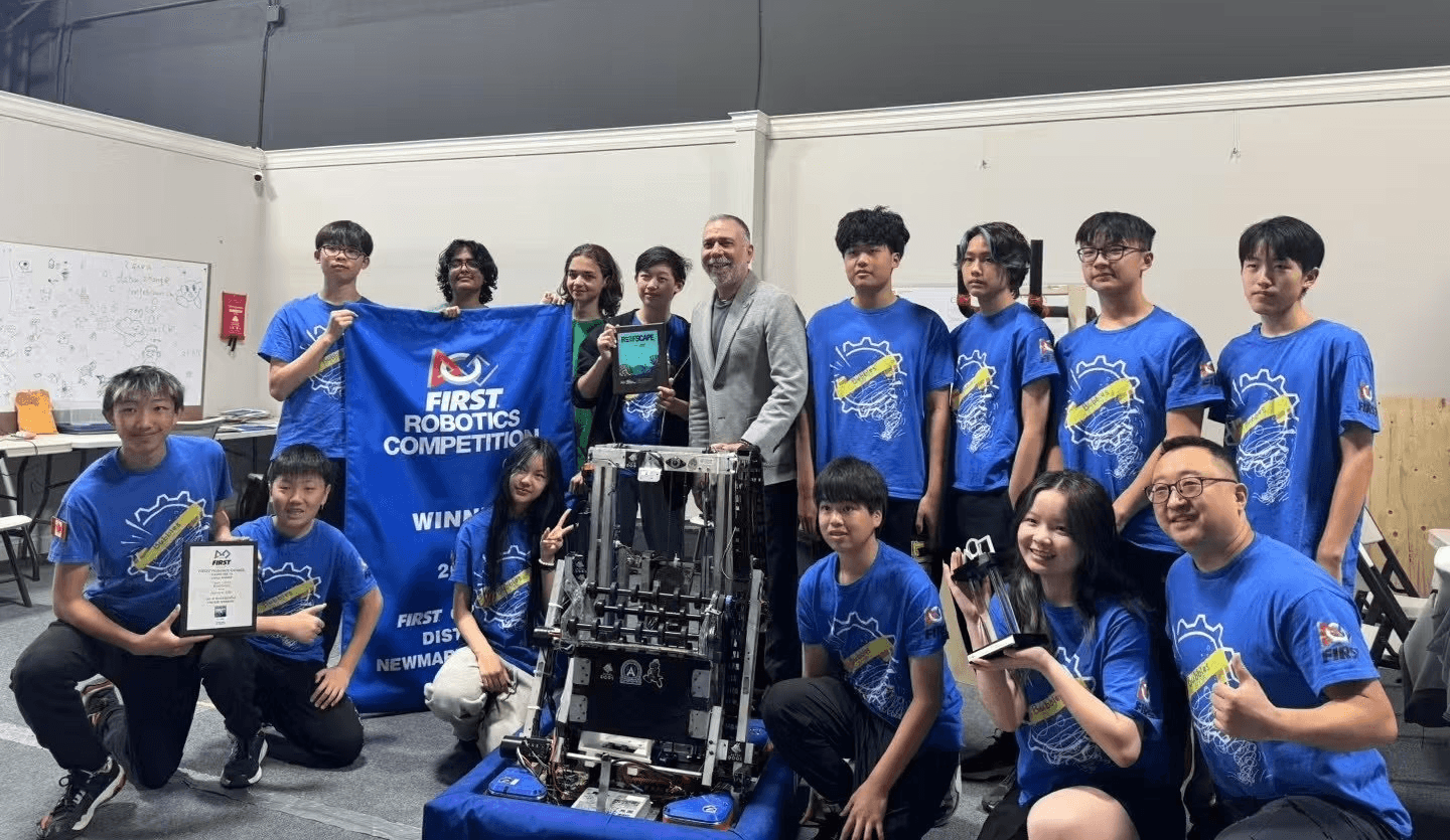 Led by team captain Ryan Zhang, SolversMind students and Aurora Mayor Tom Mrakas celebrate their 2025 World Championship achievements