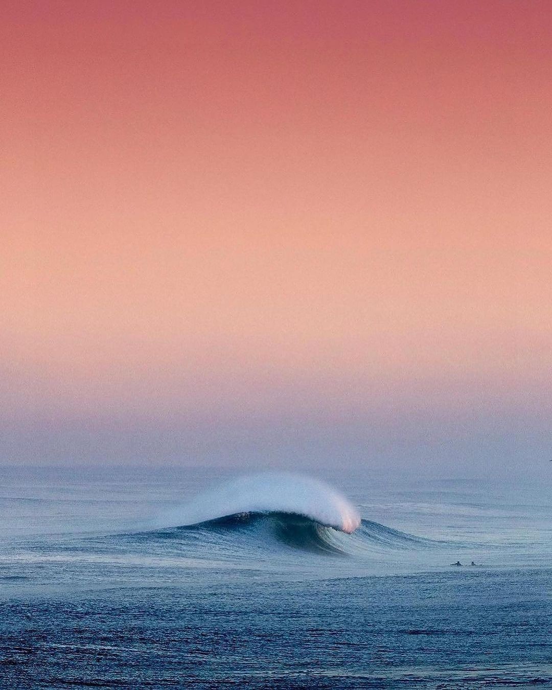 Ocean wave at sunset