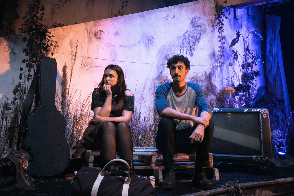 Two young adults sitting together