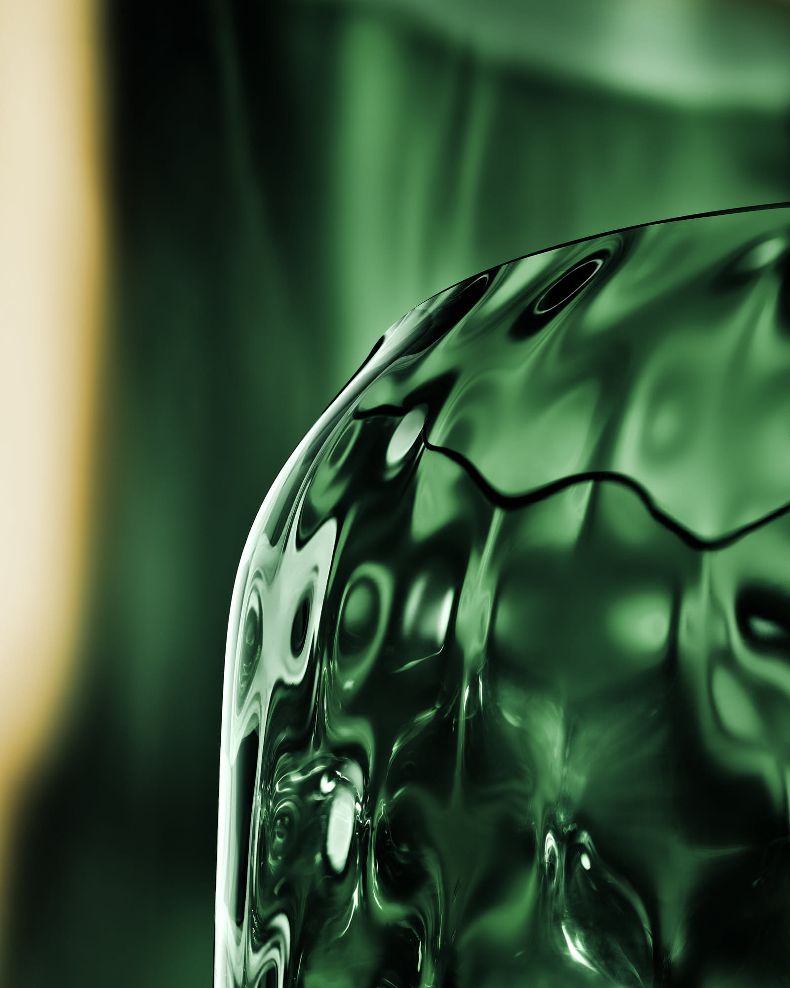 Abstract green wave pattern, close-up texture with fluid design.