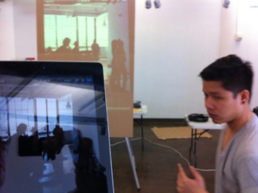 A person is testing the projector for the exhibition