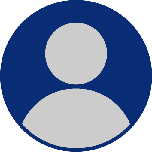 man standing beside wall