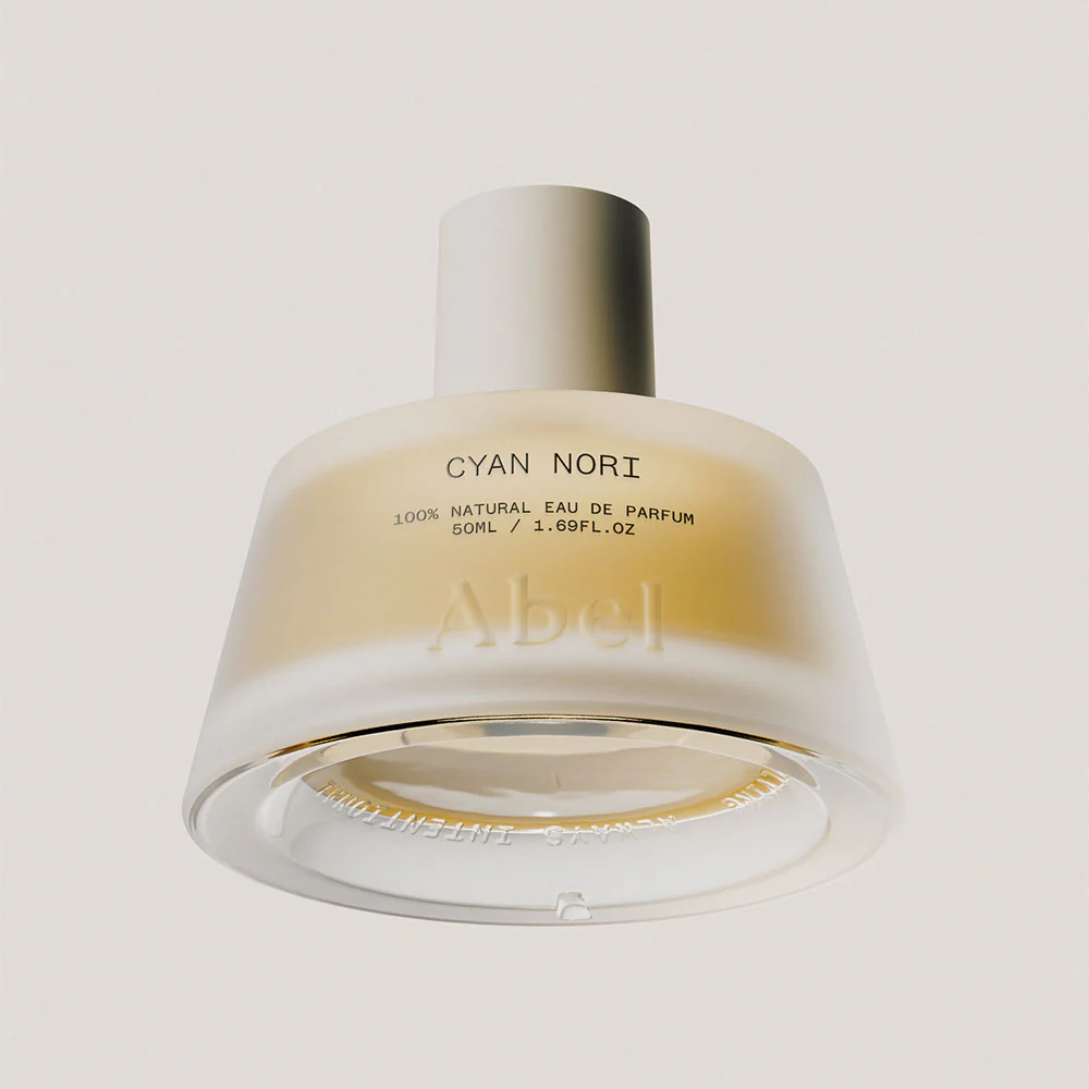 Abel Fragrance luxury perfume bottle featuring a custom 'Radical Cap' made of VIVOMER. Heralded by Abel as a shift from plastic to biotech, this premium, soft-to-touch fragrance cap is completely stable in use but acts as a truly circular solution to plastic waste, fully home-composting in soil within 52 weeks