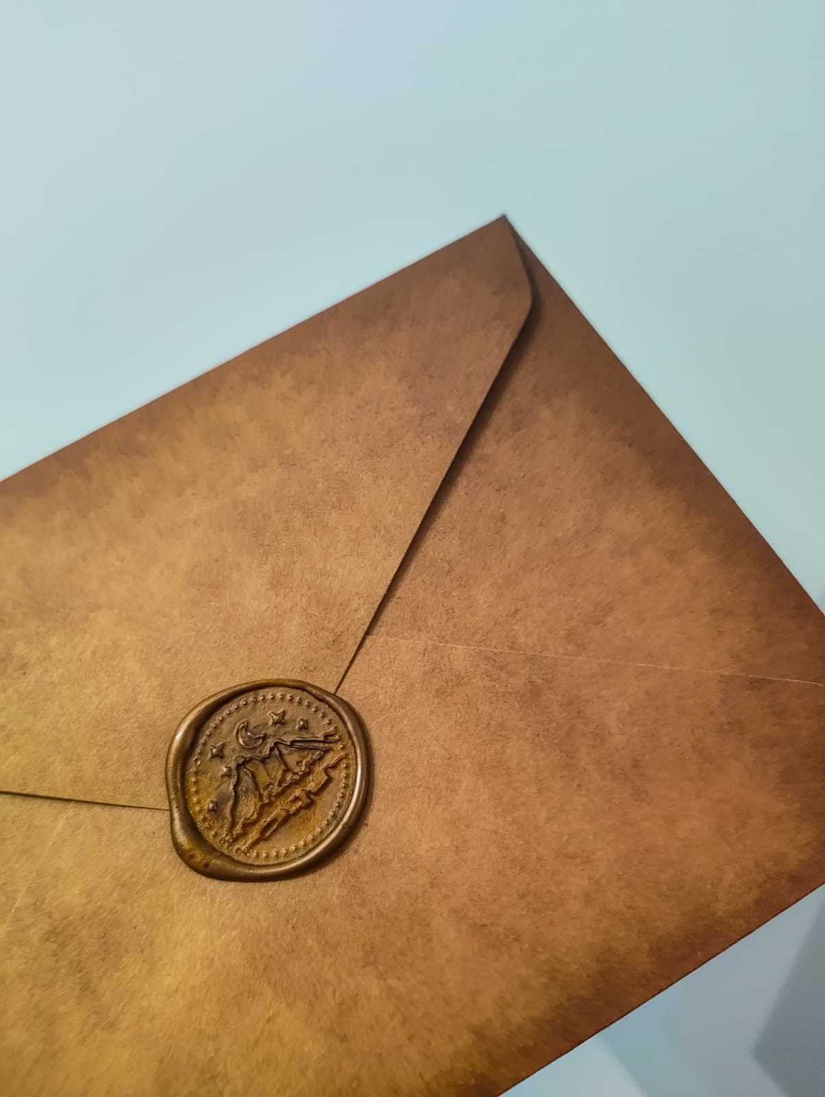A close-up of a serene face illuminated by soft light, with shadows creating a patterned effect across the skin.