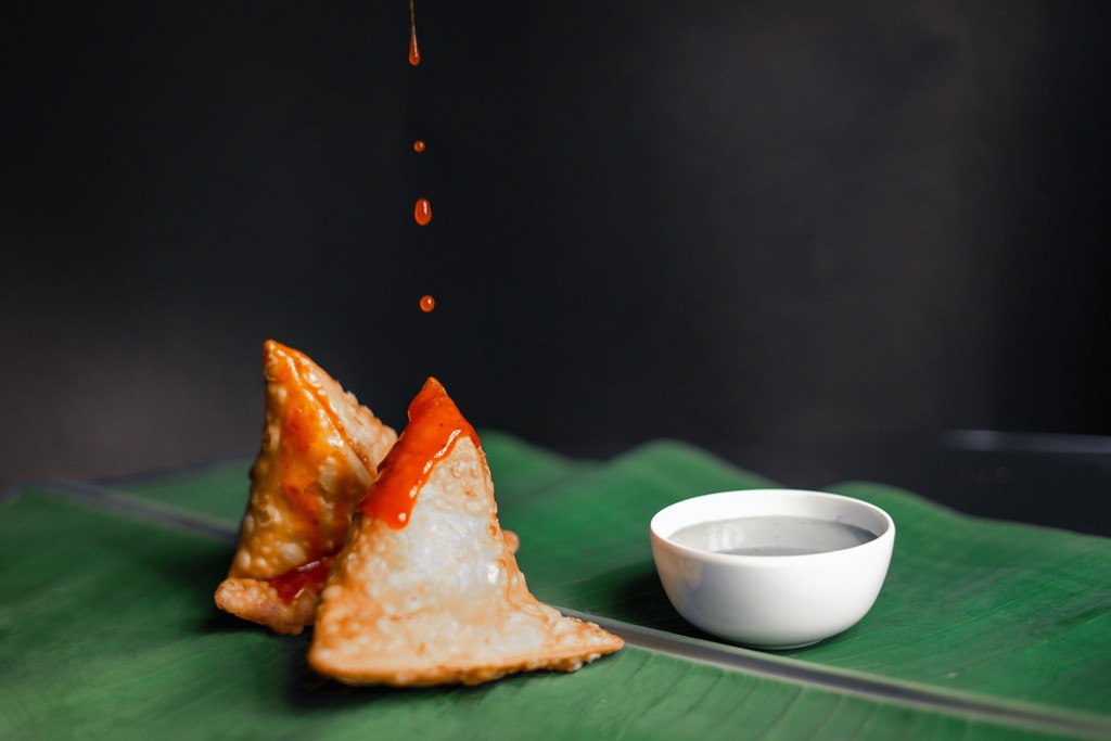 man holding dish to serve