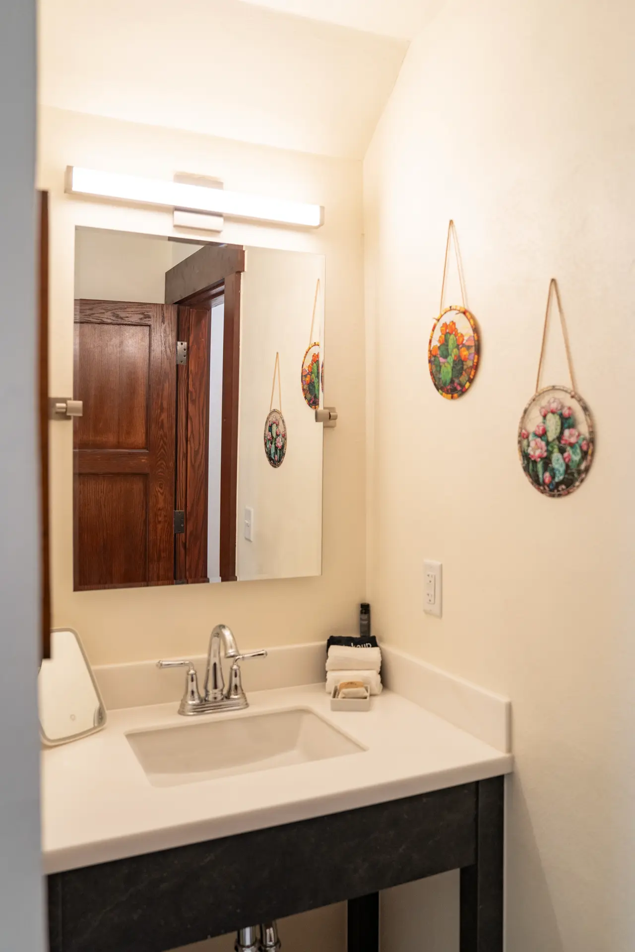 Bathroom vanity with cactus art