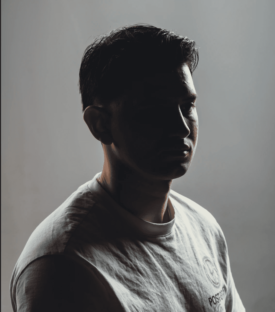 a blurry photo of a person standing in front of a wall