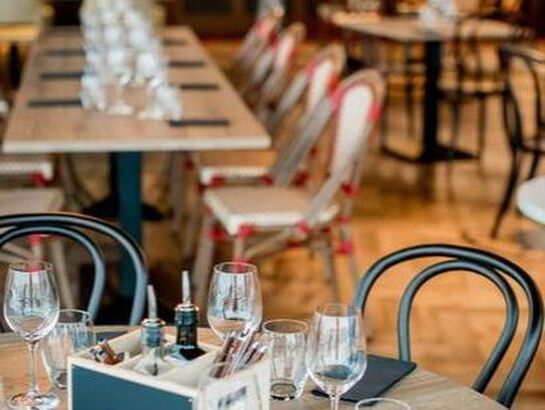 Aldelo ePay male clerk using it in front of a customer.