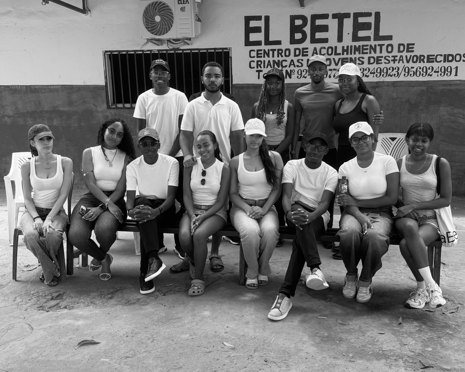 a black and white living room with a large tv