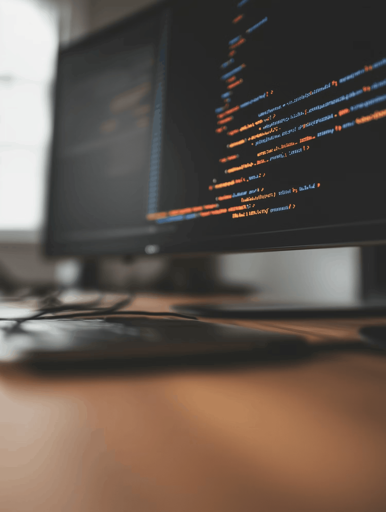 Laptop with code on screen representing creative development services