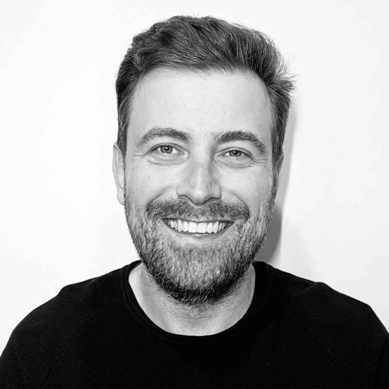 a woman in a pink dress posing for a picture