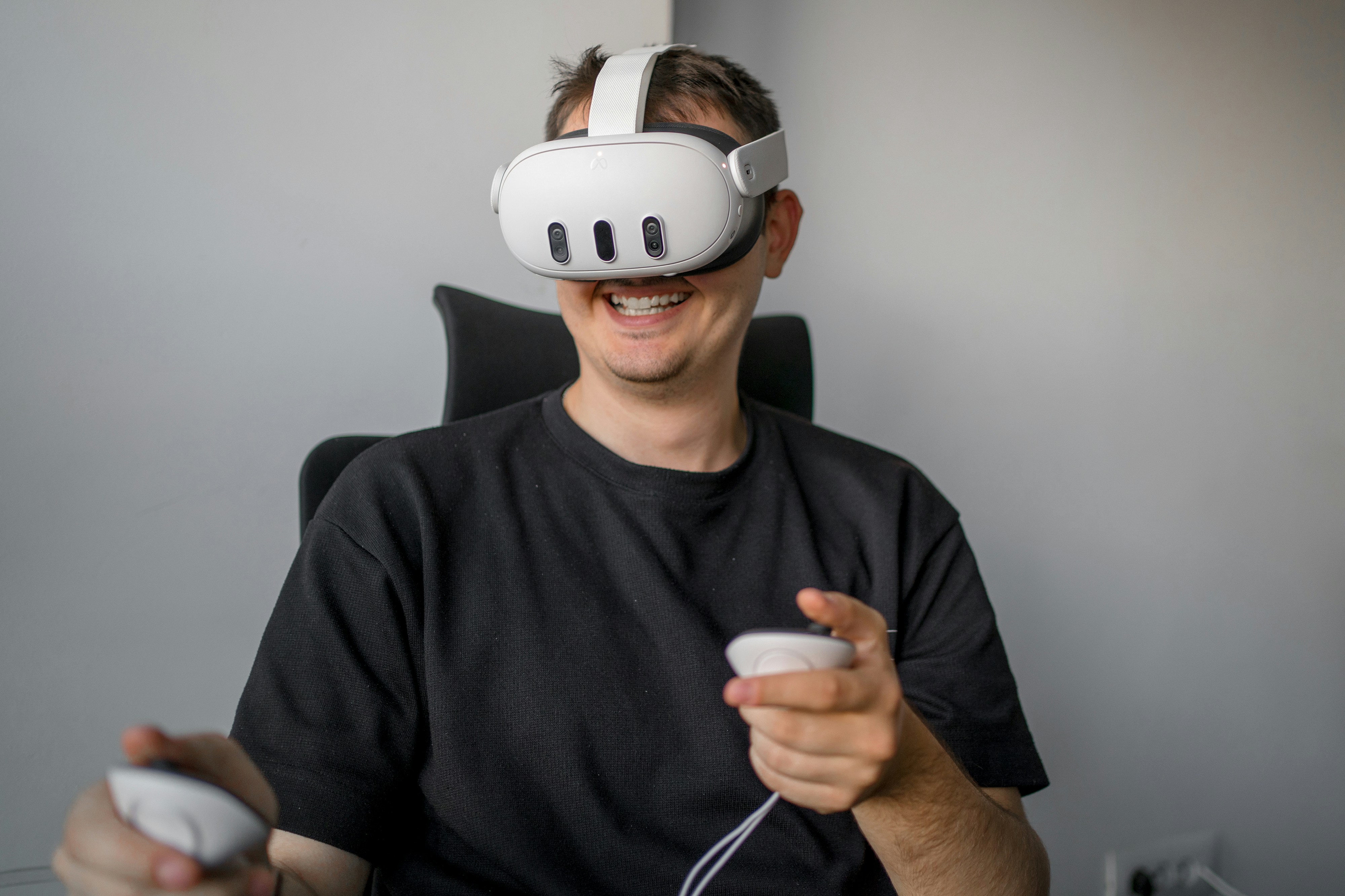 This image shows a man wearing a Meta Quest 3 headset. The meta quest 3 might be the future of mixed reality.