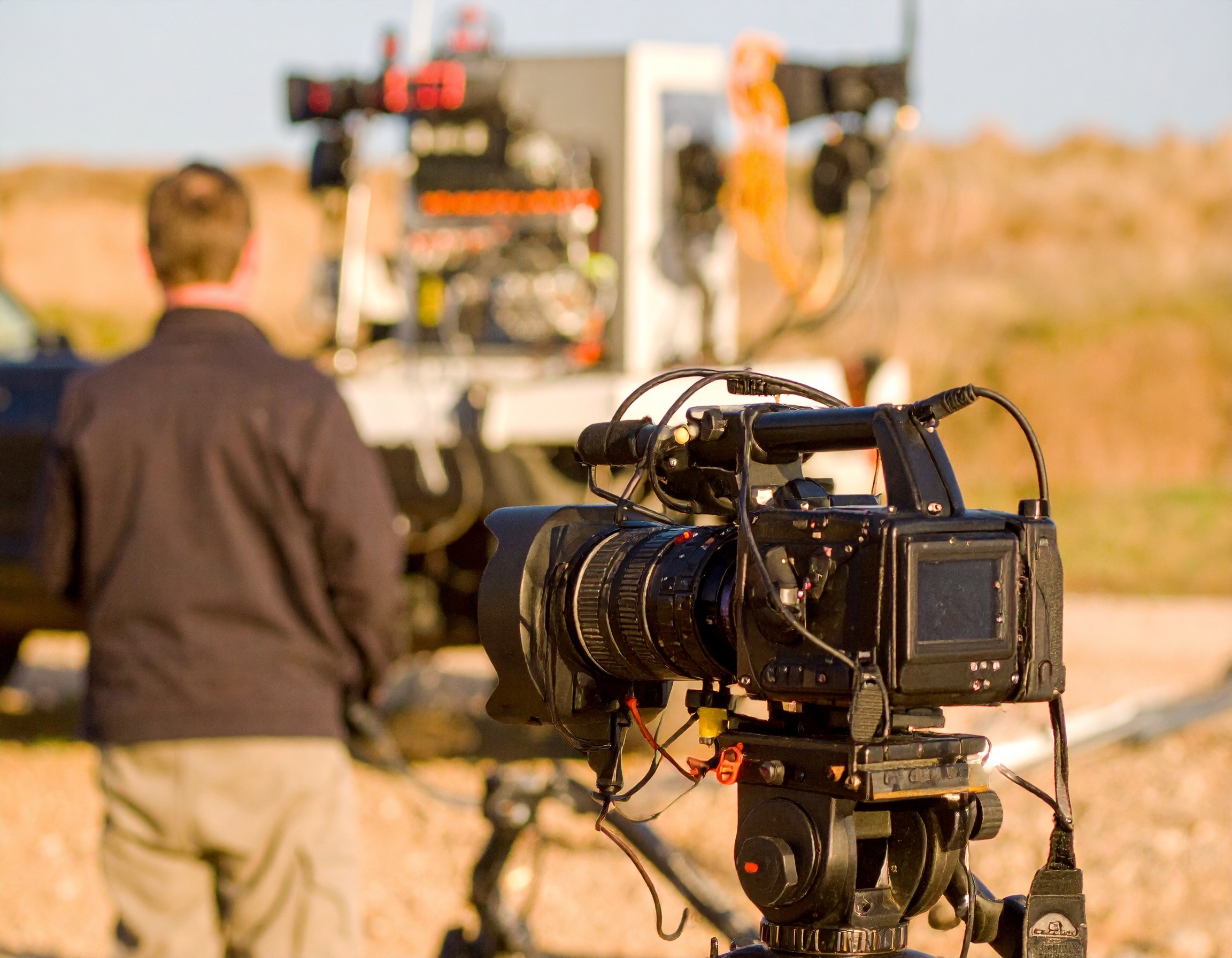 a pile of debris sitting on top of a dirt field