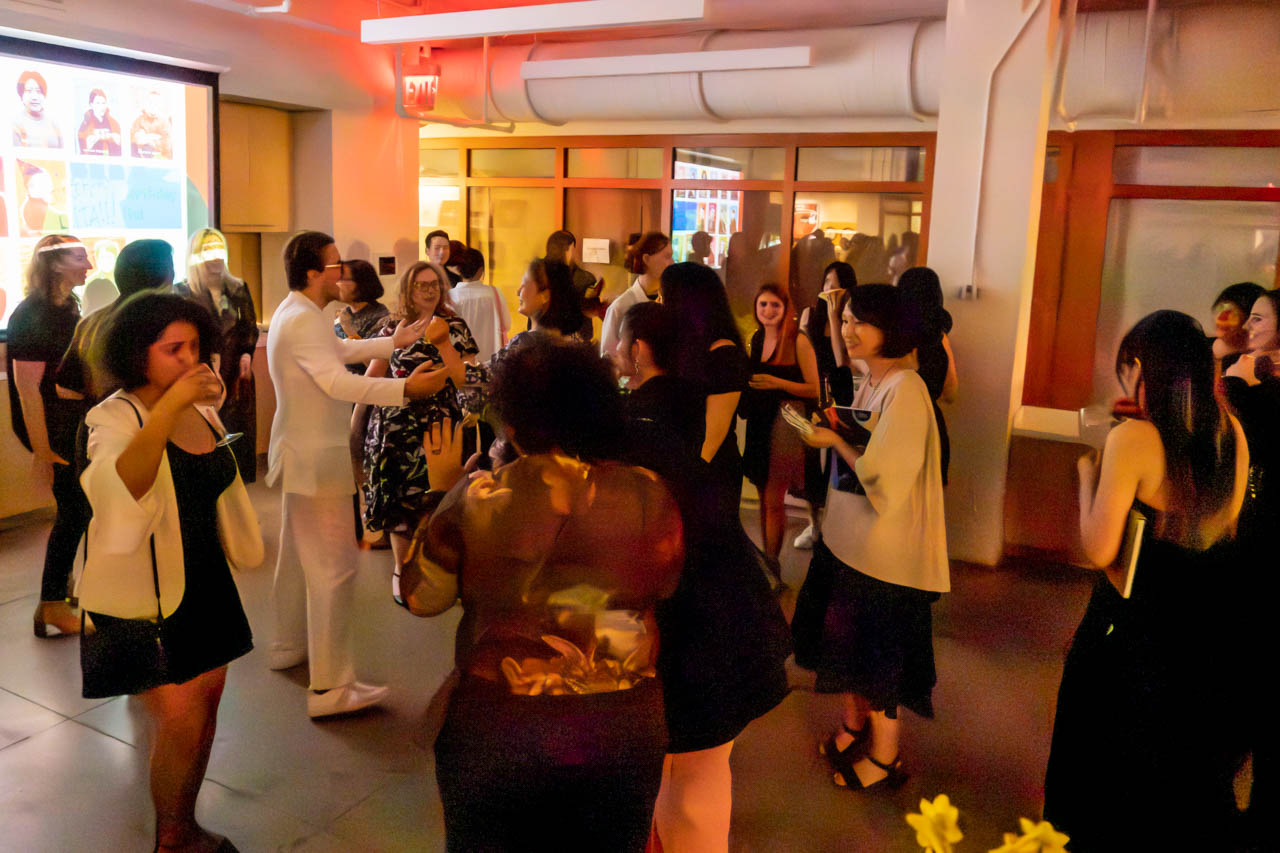 many people dancing at a party