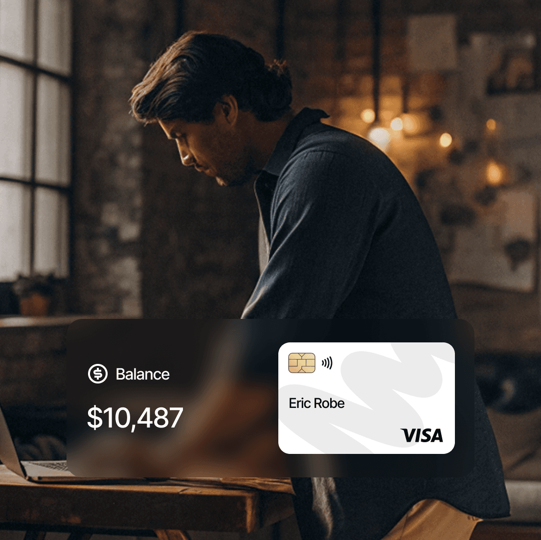 Man checks credit card balance of $10,487. Visa card with the name Eric Robe displayed.