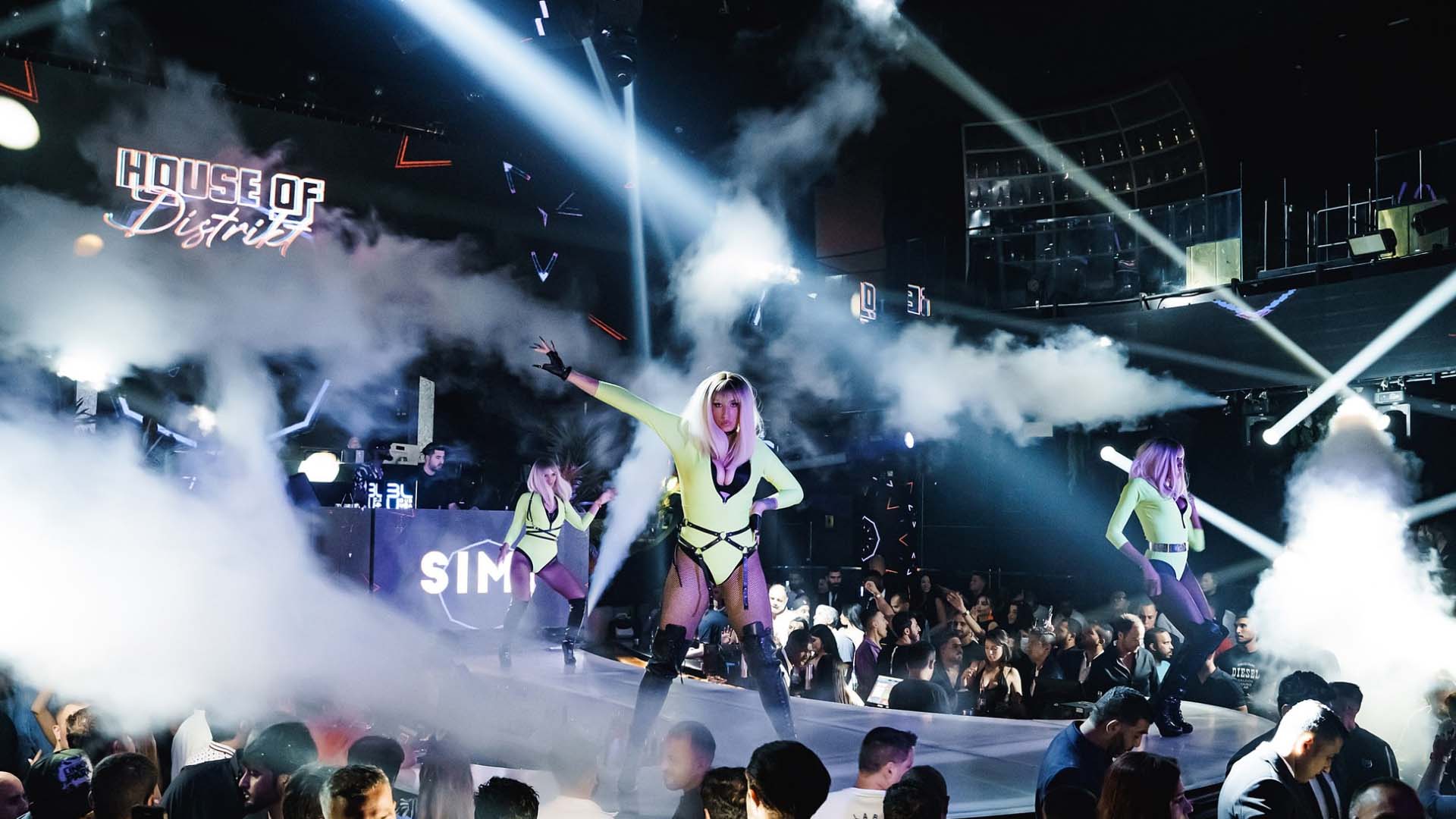 shallow focus photo of woman in black sleeveless shirt doing yoga