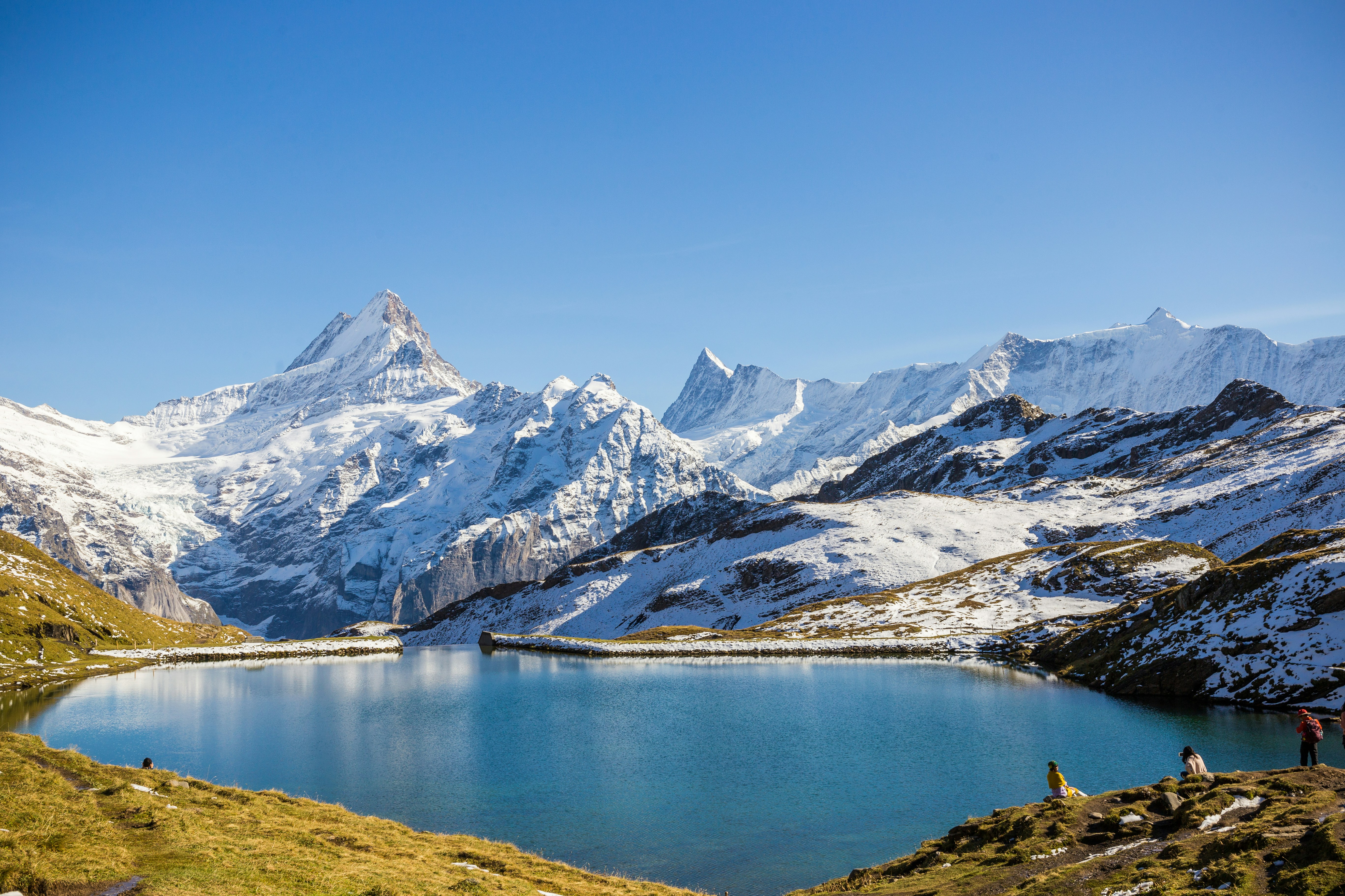 A panoramic view of snowy mountains as seen from Bachalpsee in the Grindelwald region of Switzerland.