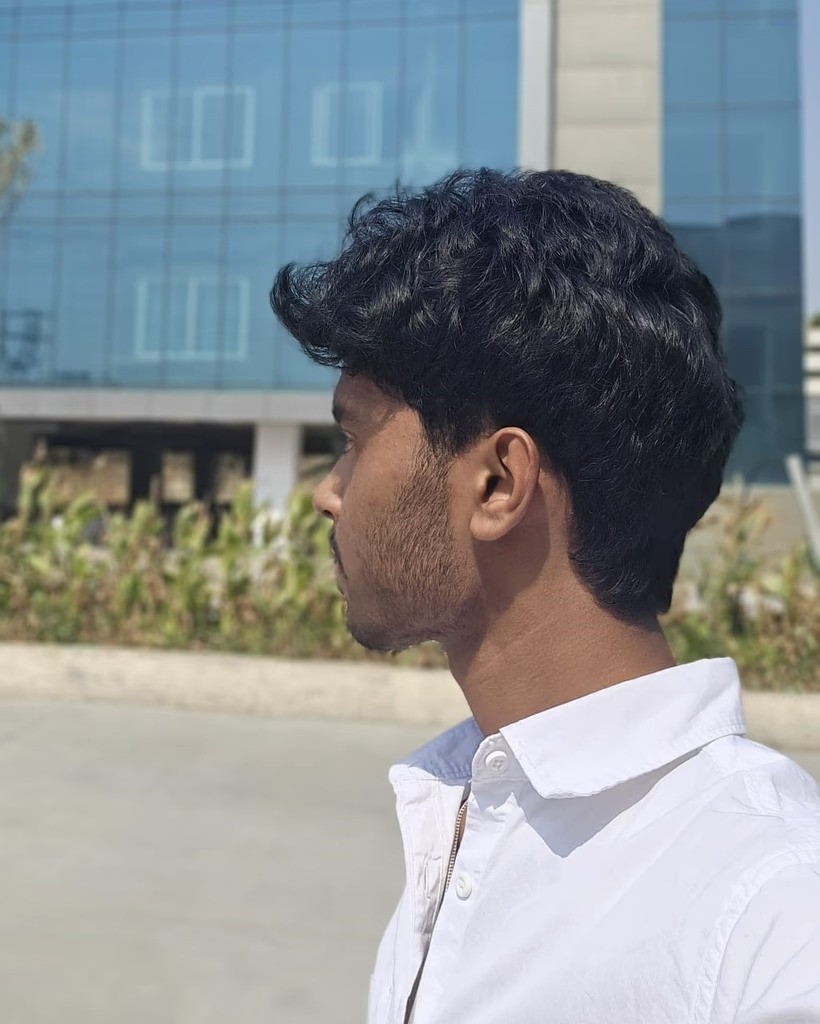 a side picture of Sharan Tej