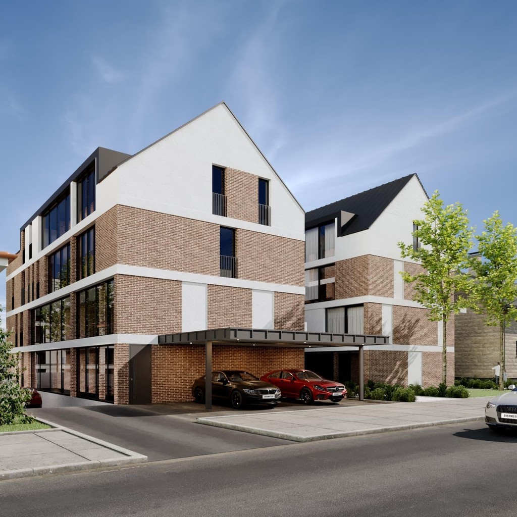 Moderne Architektur des Neubauprojekts Bahnhofstraße 31 in Remshalden-Grunbach. Hochwertige Fassade mit weißem Putz und Klinkersteinen in der Ansicht von der Haupstraße aus mit Carport am Haus unter dem zwei PKW stehen.