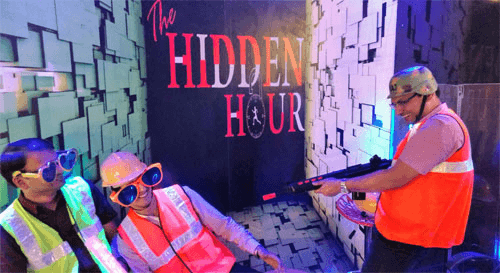 College students playing mystery escape games at a Hidden Hour centre