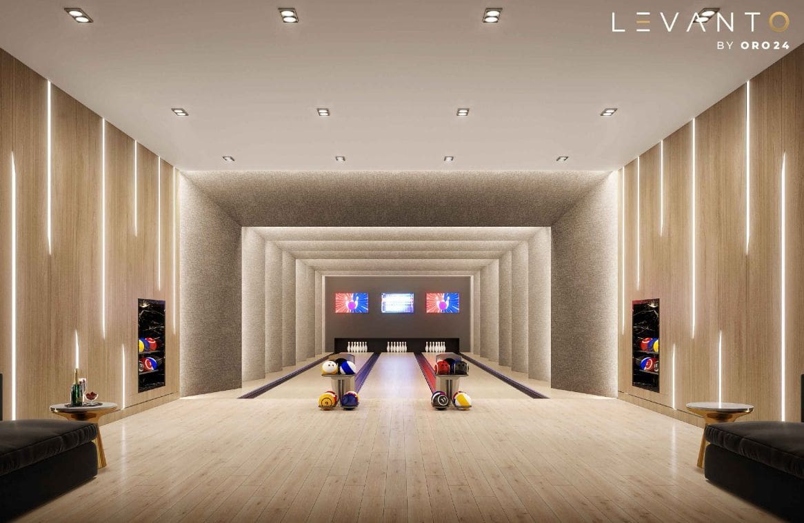 A vibrant bowling alley featuring multiple lanes, designed by Levanto by ORO24, showcasing a lively atmosphere.