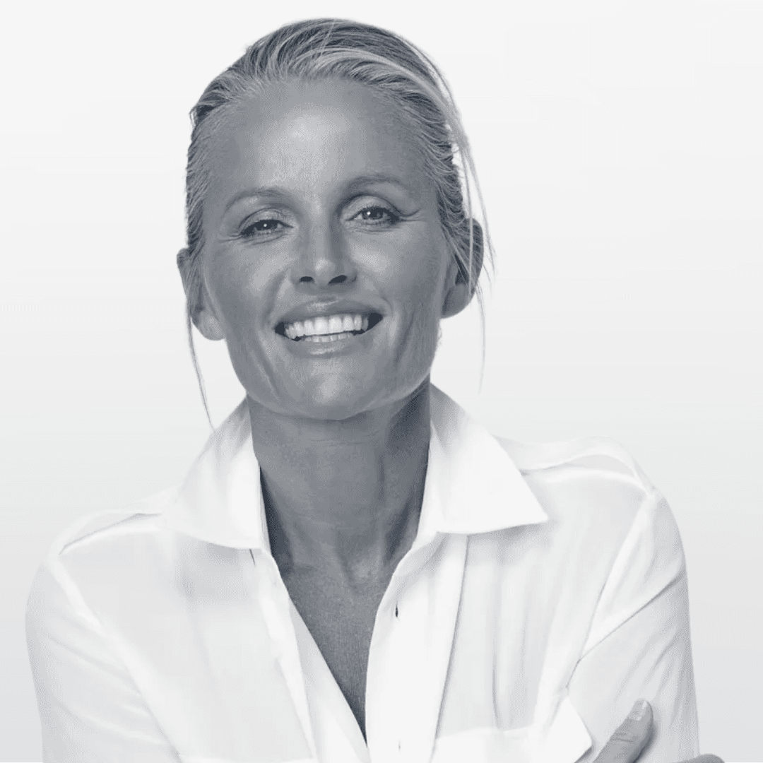 Portrait of a young man with short hair, wearing a dark t-shirt, against a plain background.