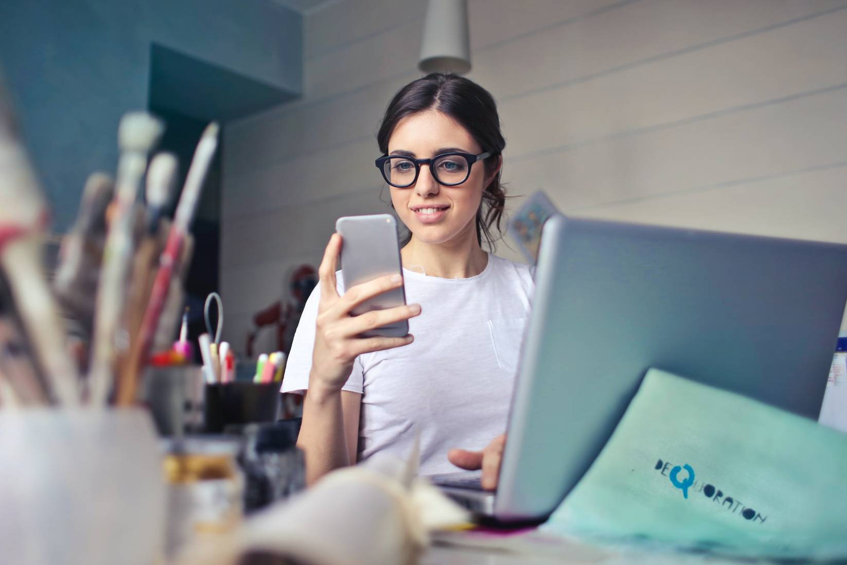 image of woman holding phone