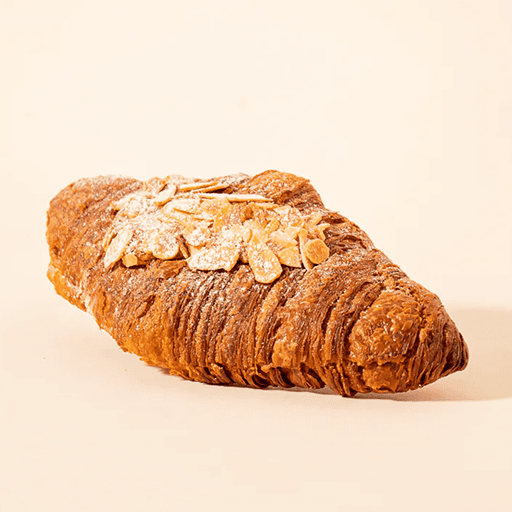 clear drinking glass with coffee on top of white table