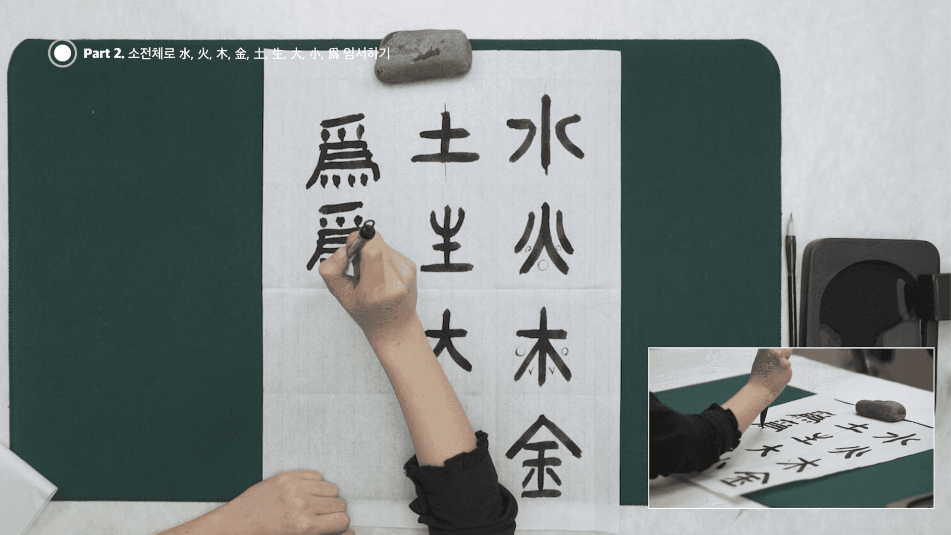 person writing on a piece of paper 