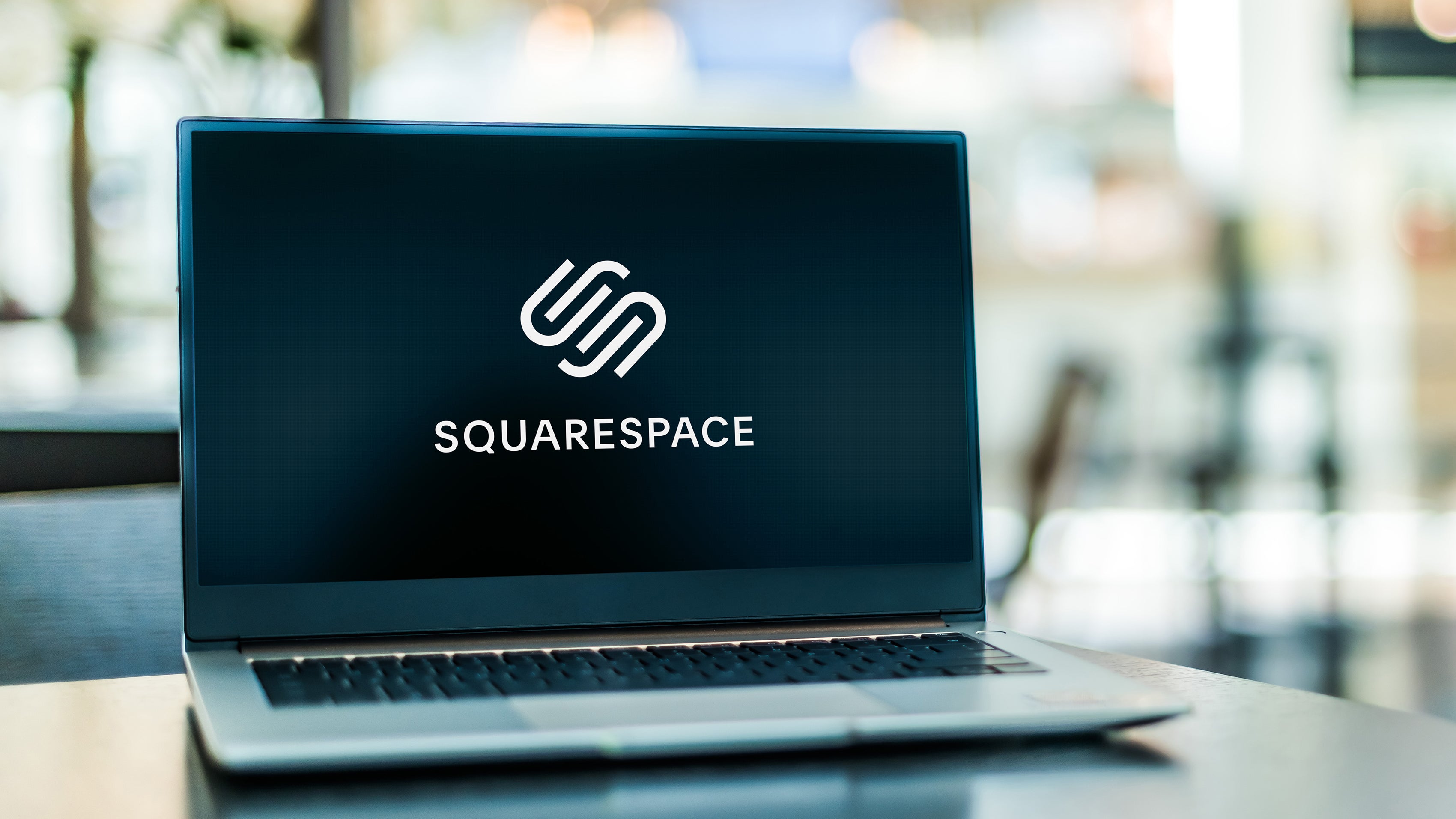 The Squsarespace logo displayed on a laptop screen